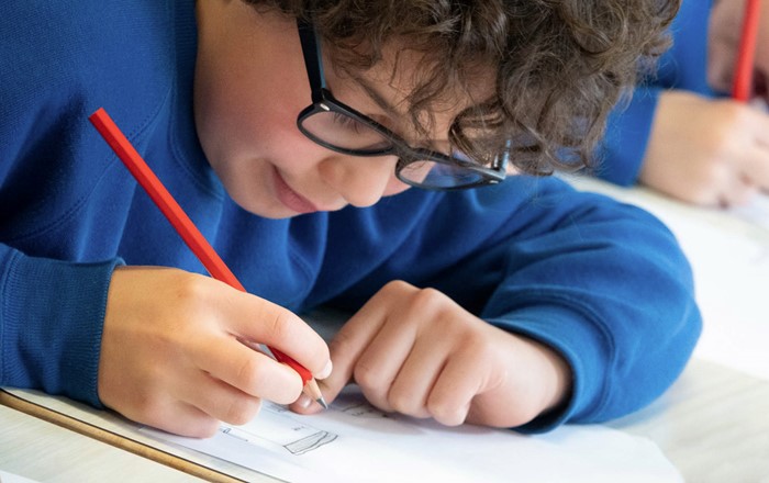 School pupil writing 