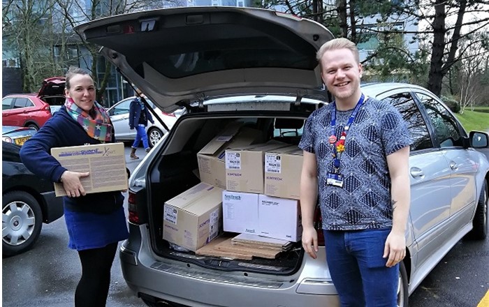 University staff loading up medical supplies for Singleton Hospital