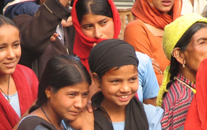 Nepalese children enjoying a show teaching them about burn prevention during the project.