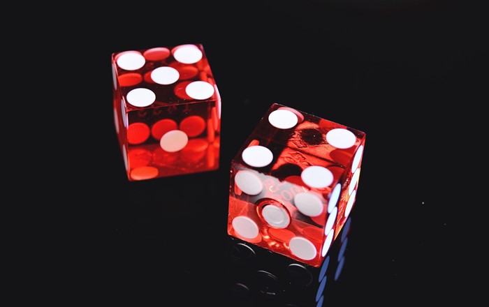 Picture shows two red dice.