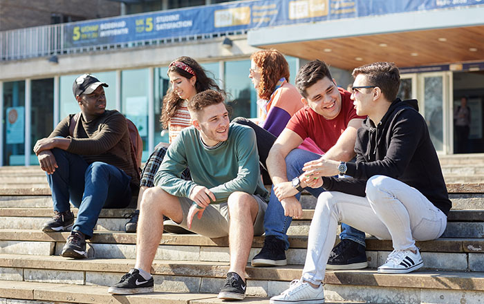 A group of students sat outside Fulton House 