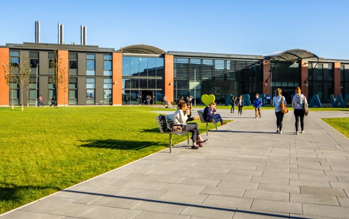 Engineering students walking at the Bay Campus.