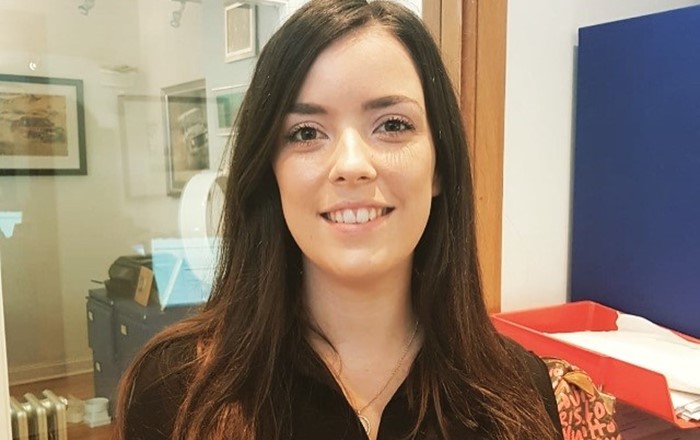 Close up shot of smiling young woman with shoulder length brown hair - Abbie Thomas