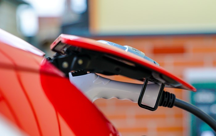 A charger plugged into an electric car