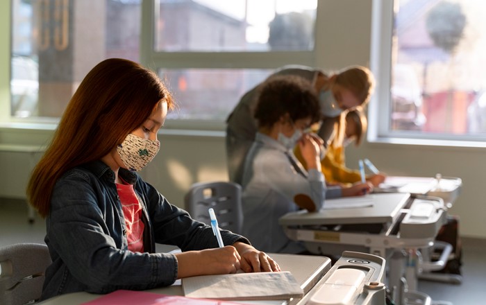 Pupils in a classroom wearing facemasks