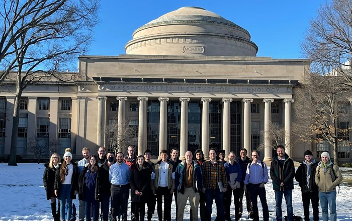 The AIMLAC delegation and members of IAIFI are pictured in front of MIT's Great Dome. 