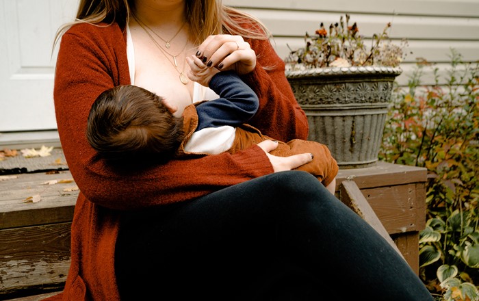 Baby being breastfed. 