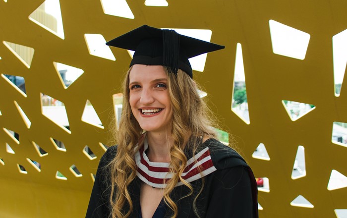 Jessica Smith in her graduation cap and gown.