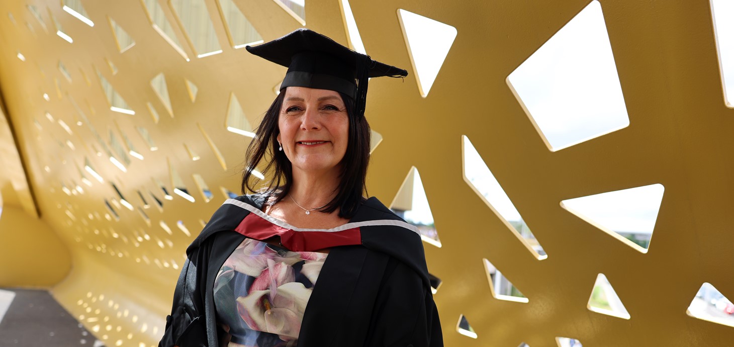 A photo of Michelle Morgan in her graduation cap and gown.