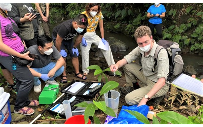 Aaron Todd (right) with Filipino colleagues. He conducted fieldwork with a team of eight researchers across two river catchments, collecting water and sediment samples