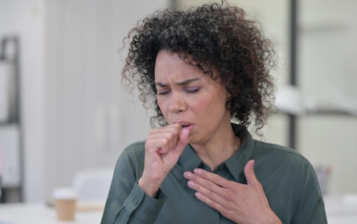 A woman coughing