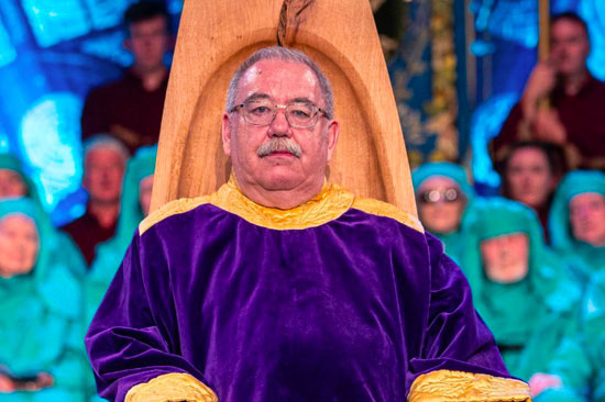 Professor Alan Llwyd being chaired on the Eisteddfod stage