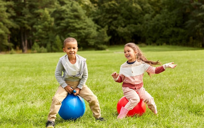 Children bouncing on space hoppers: Three researchers in children’s physical activity and health presented their work at a major international conference hosted by Swansea University, supported by awards from the Worshipful Livery Company of Wales.