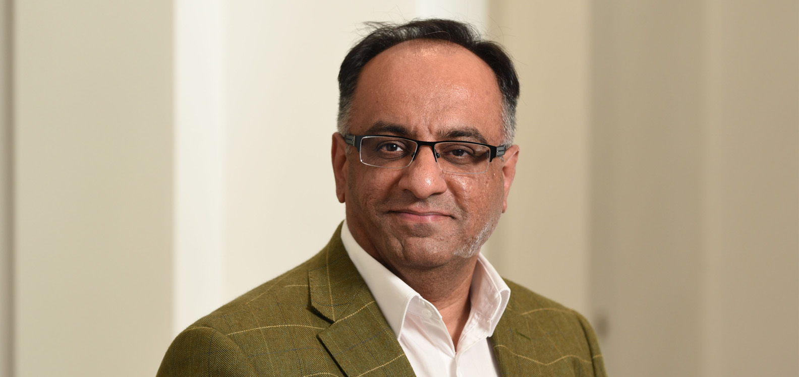 A head and shoulders shot of Professor Siraj Shaikh.