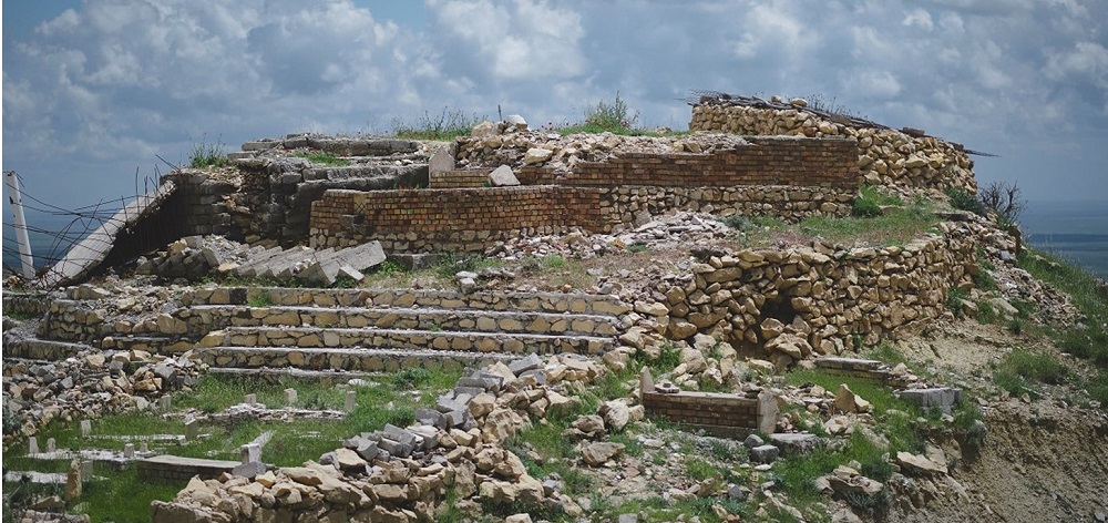 Yazidi shrine of Mame Reshan in Shingal, Iraq, after its destruction by Islamic State, credit: Levi Clancy. Cultural heritage such as sacred sites is crucial for the identity and mental health of displaced peoples. 