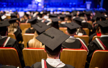 Graduates sitting in their graduation ceremony