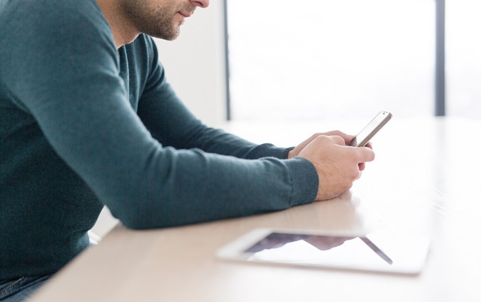 Mobile phone and tablet on a desk - technology can keep going 24/7, but we aren't meant to, says Professor Judith Lamie.