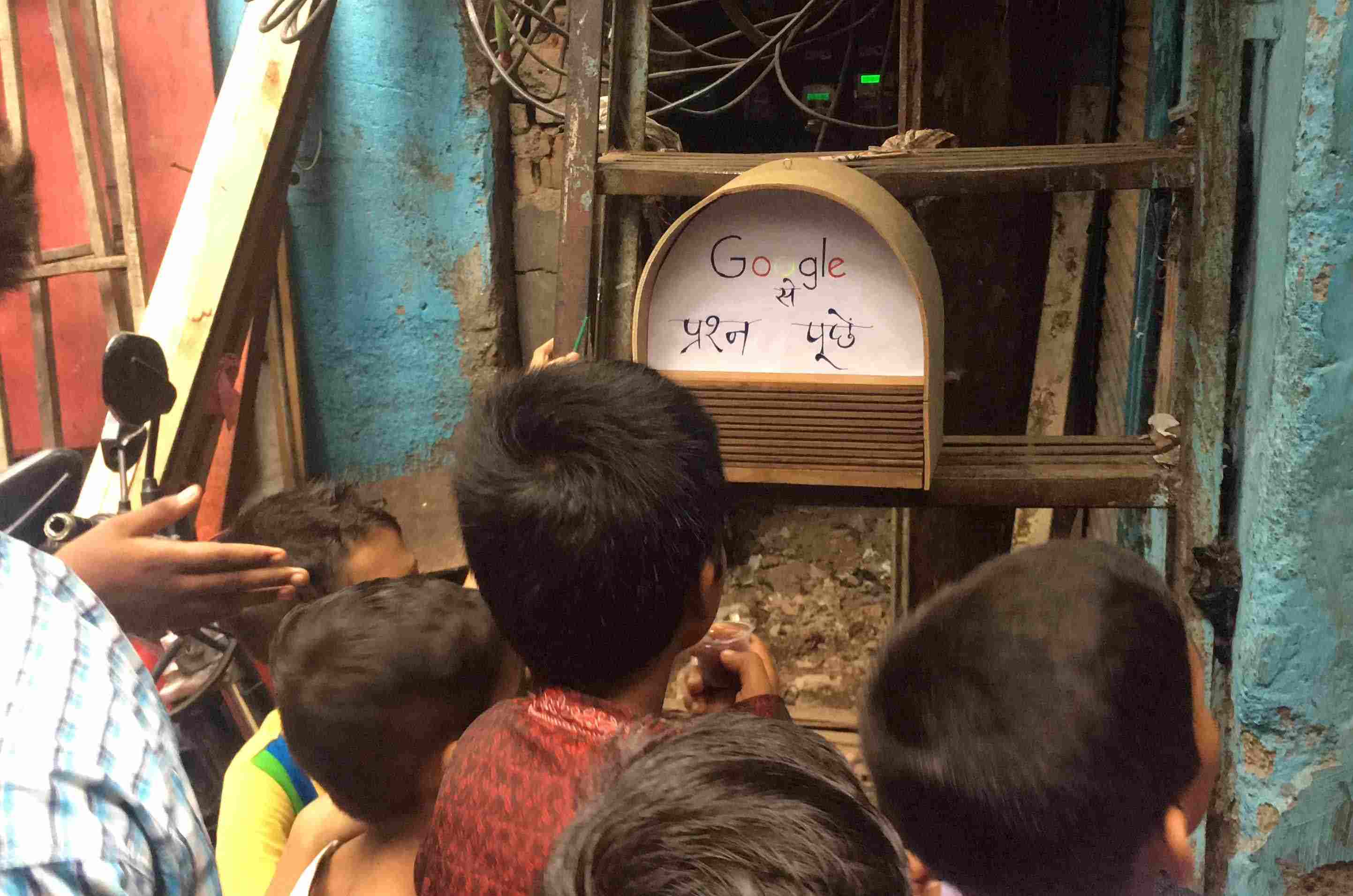 Boy in India looking at the device