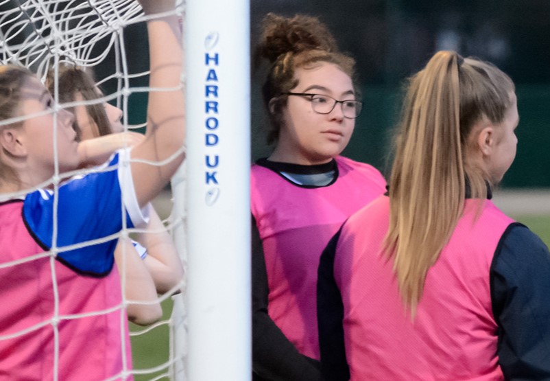 Girls playing football