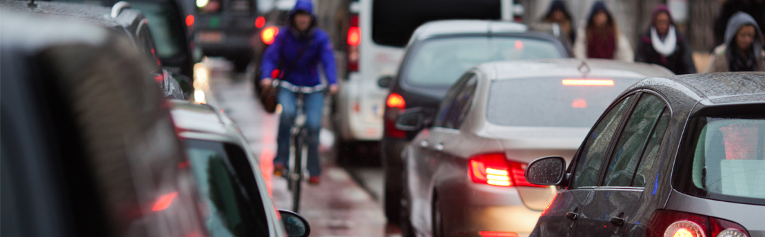 Cyclist cycling in traffic