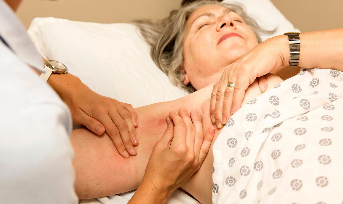 Hands massaging a woman's arm