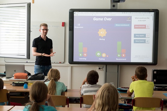 Teacher in classroom with children