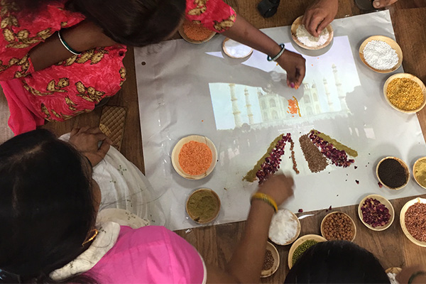 Woman gathered around a table with ingredients on