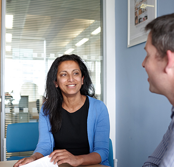 Professor Ann John talking to a researcher. 