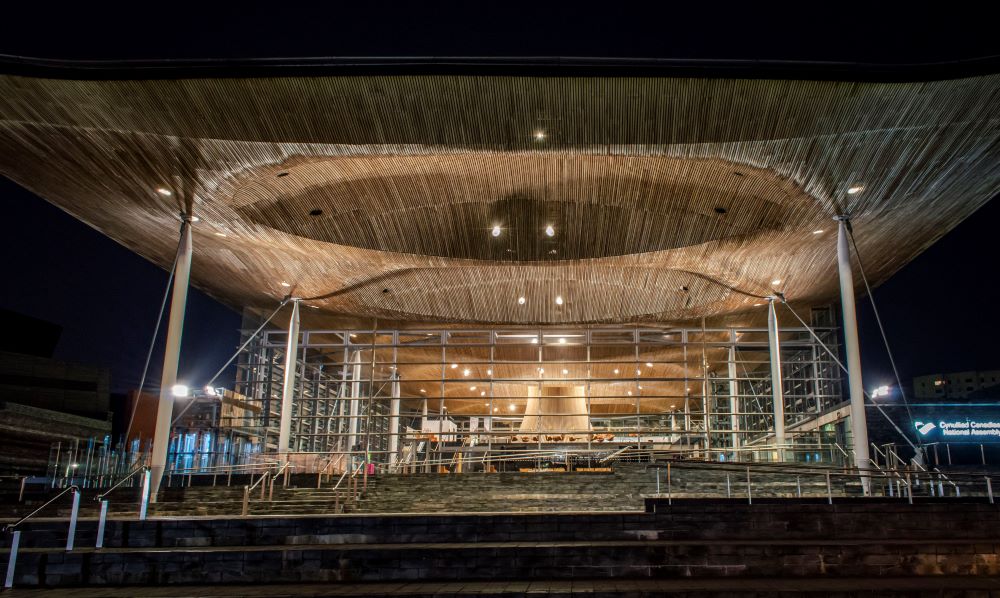 Senedd with Welsh flag overlay