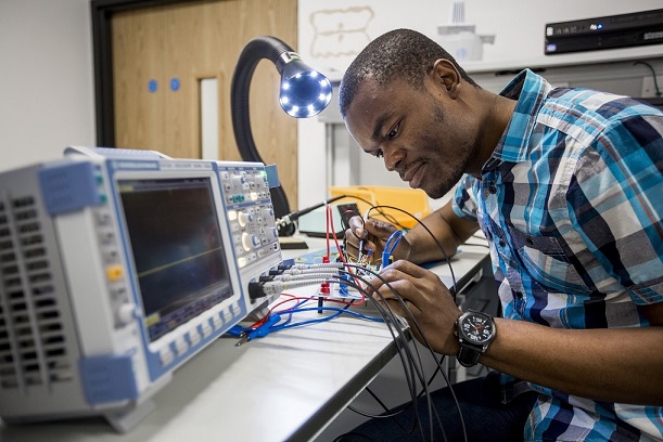 Student working on electrical equipment 