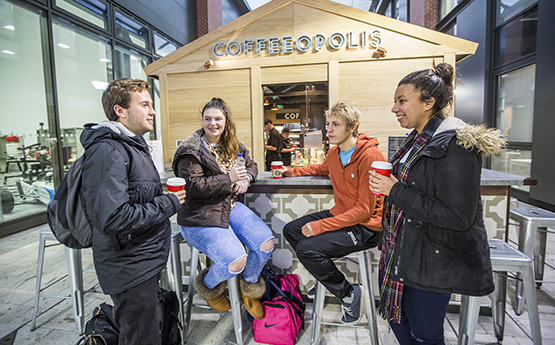 students chatting at coffeeopolis