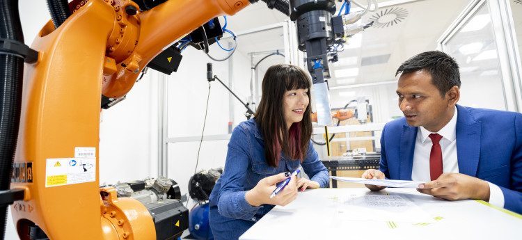 Postgraduate research students working on a project