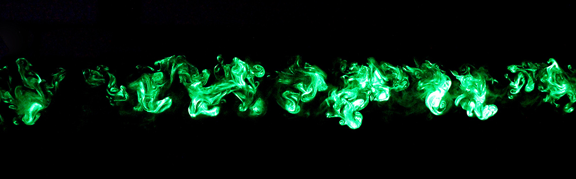 green smoke in dark wind tunnell