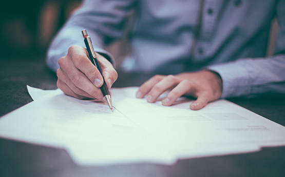 man writing a report