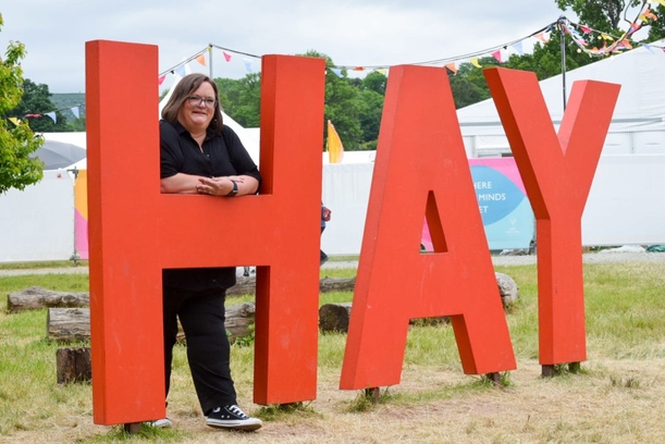 lecturer with hay sign