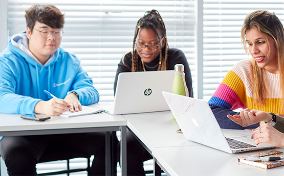 Students studying at a table