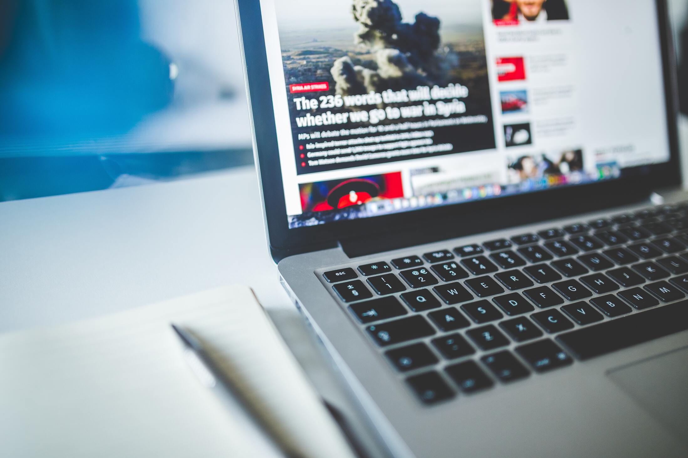 Laptop with news article on screen 