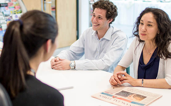 students talking with staff