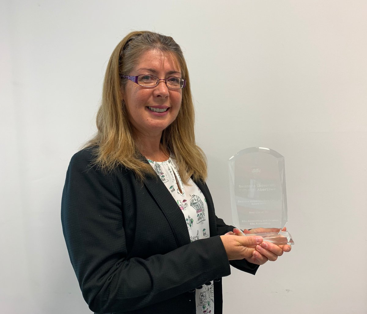 Associate Professor Terry Filer receiving her award