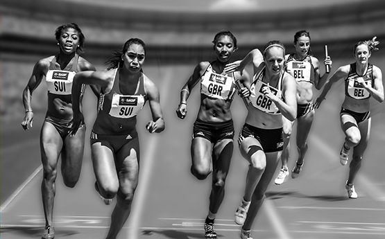 Female athletes running on a track