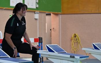 Swimming coach, Hayley Baker, coaching the swim team 