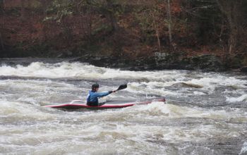 Toby Peyton-Jones in kayaking competition in Scotland