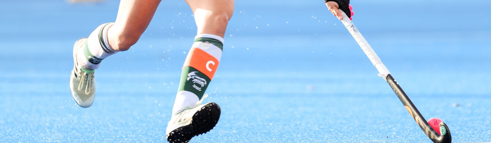 Swansea University womens hockey team on pitch at Swansea Bay Sports Park