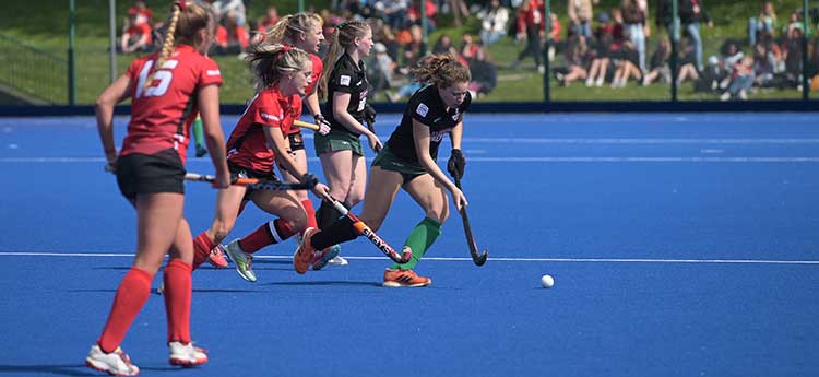 Teams playing on hockey pitch at Swansea Bay Sports Park during Wales Varsity