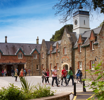 Students walking through the stable block, Singleton Campus