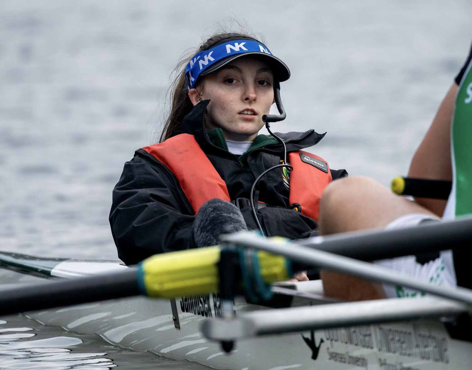 Amy competing in a rowing race