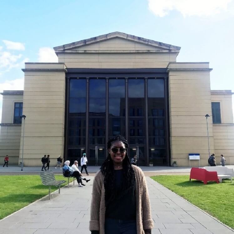 Chido Ranganayi in front of the Great Hall at the Bay Campus