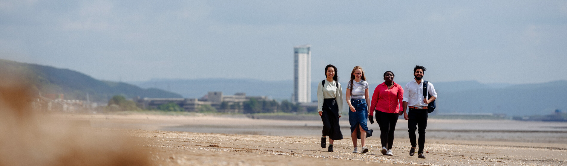 students walking on beach