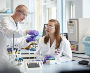 A student and lecturer in a lab