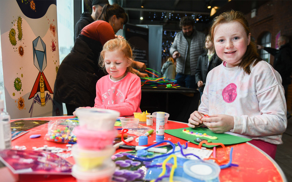 two little girls doing craft activities